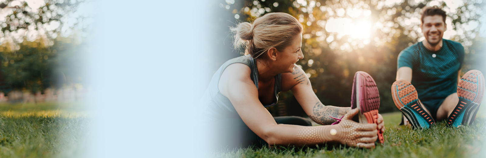 Active couple stretching outdoors — LifeWave wellness lifestyle